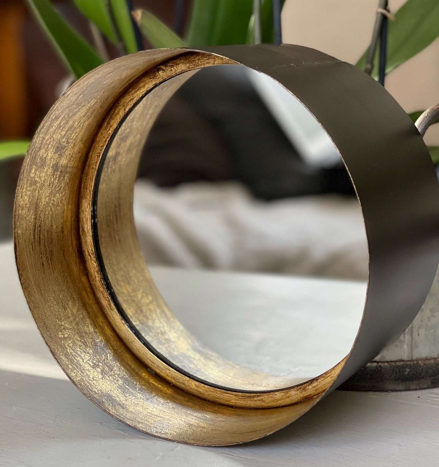 Antique style deep rim gold and black mirror.