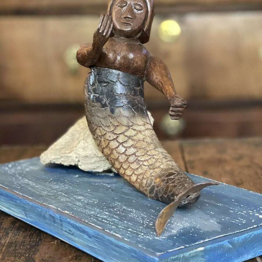 Folk art mermaid sculpture