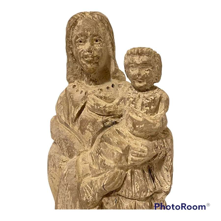Carved wooden figure of Madonna and child