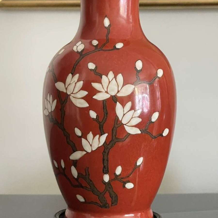 Vintage magnolia blossom red ground lamp base.