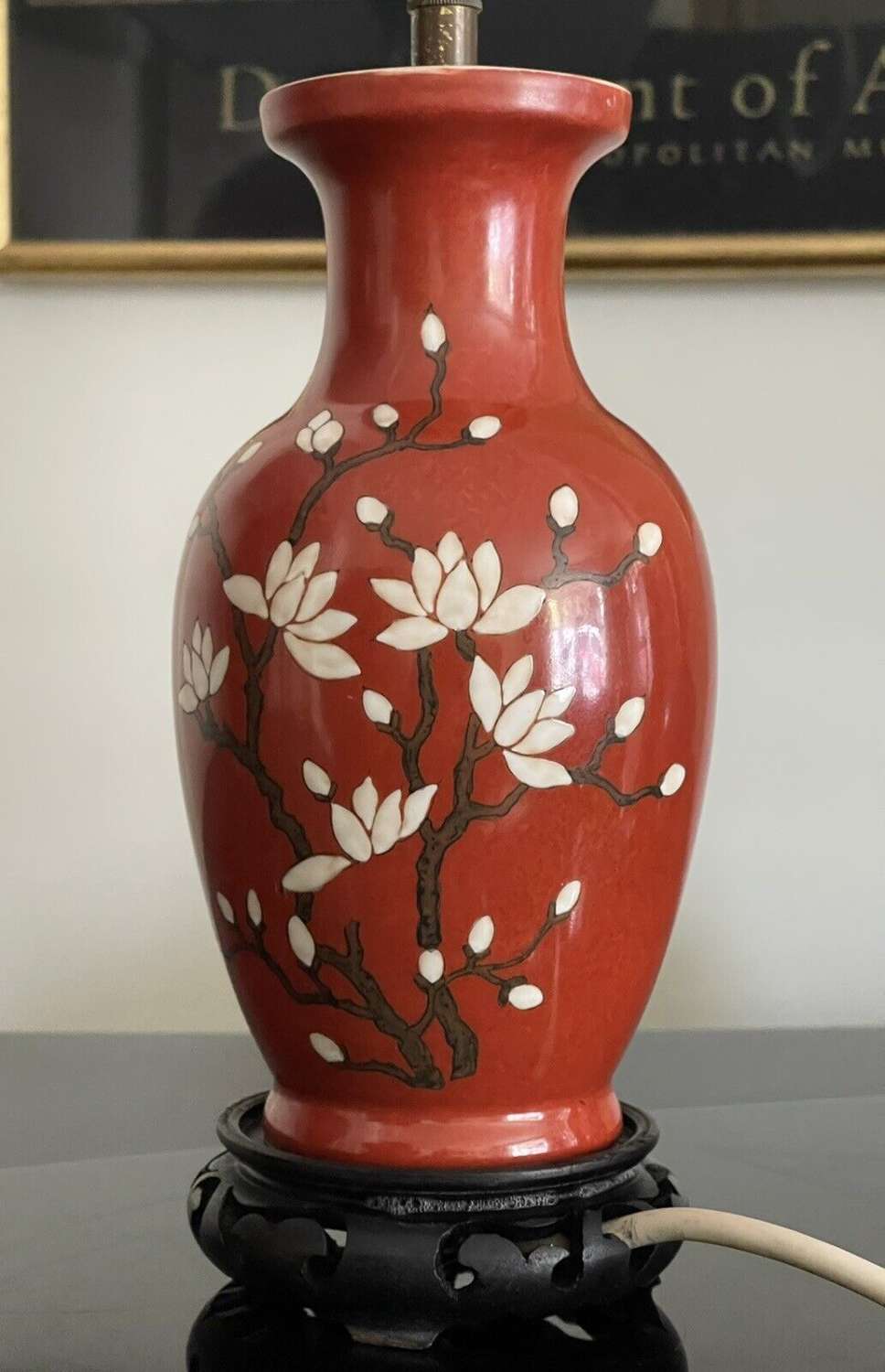 Vintage magnolia blossom red ground lamp base.