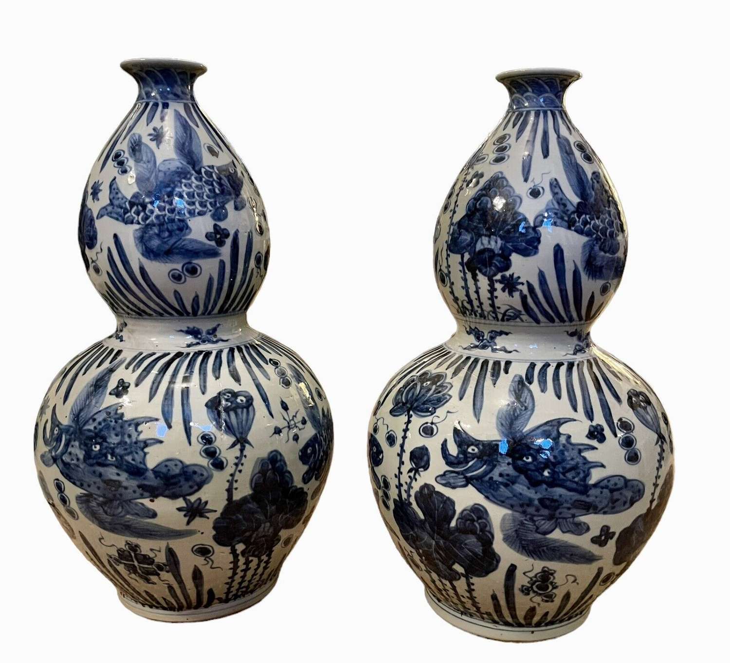 A pair of Chinese double gourd blue and white vases