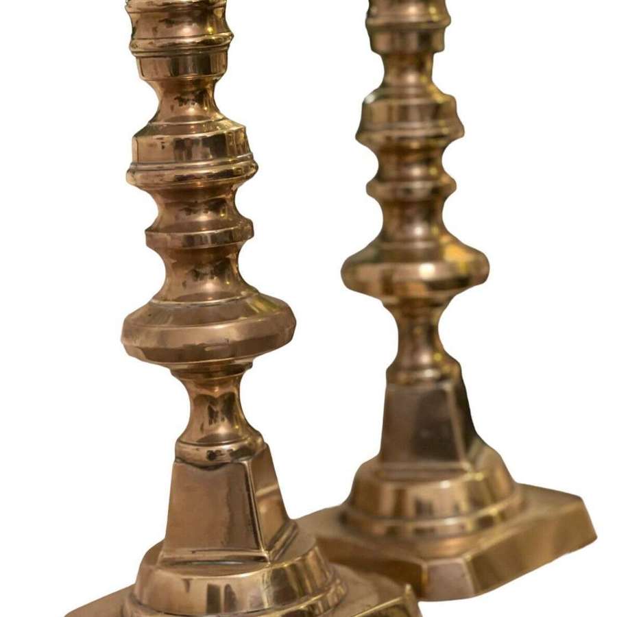 A pair of Georgian Brass candlesticks