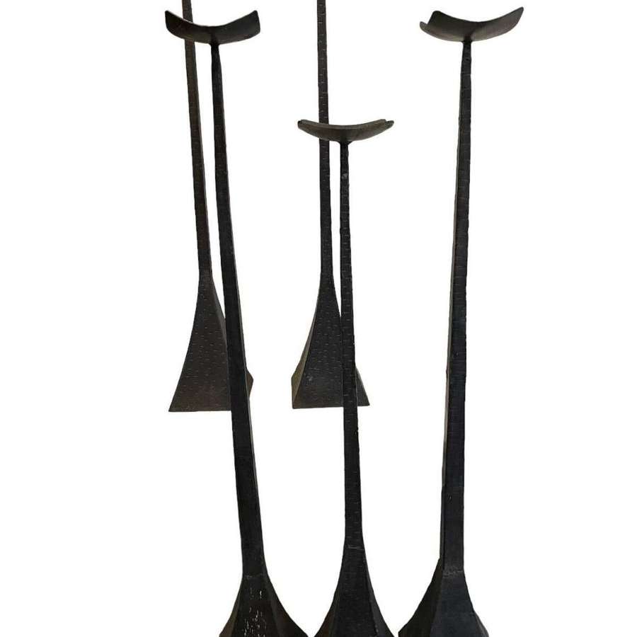 A set of five cast iron handmade brutalist Church candle holders.