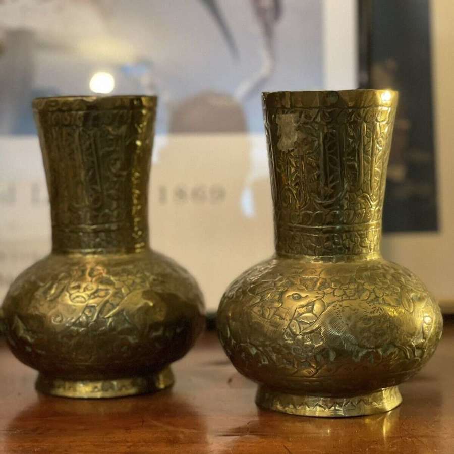 A pair of brass Islamic vases