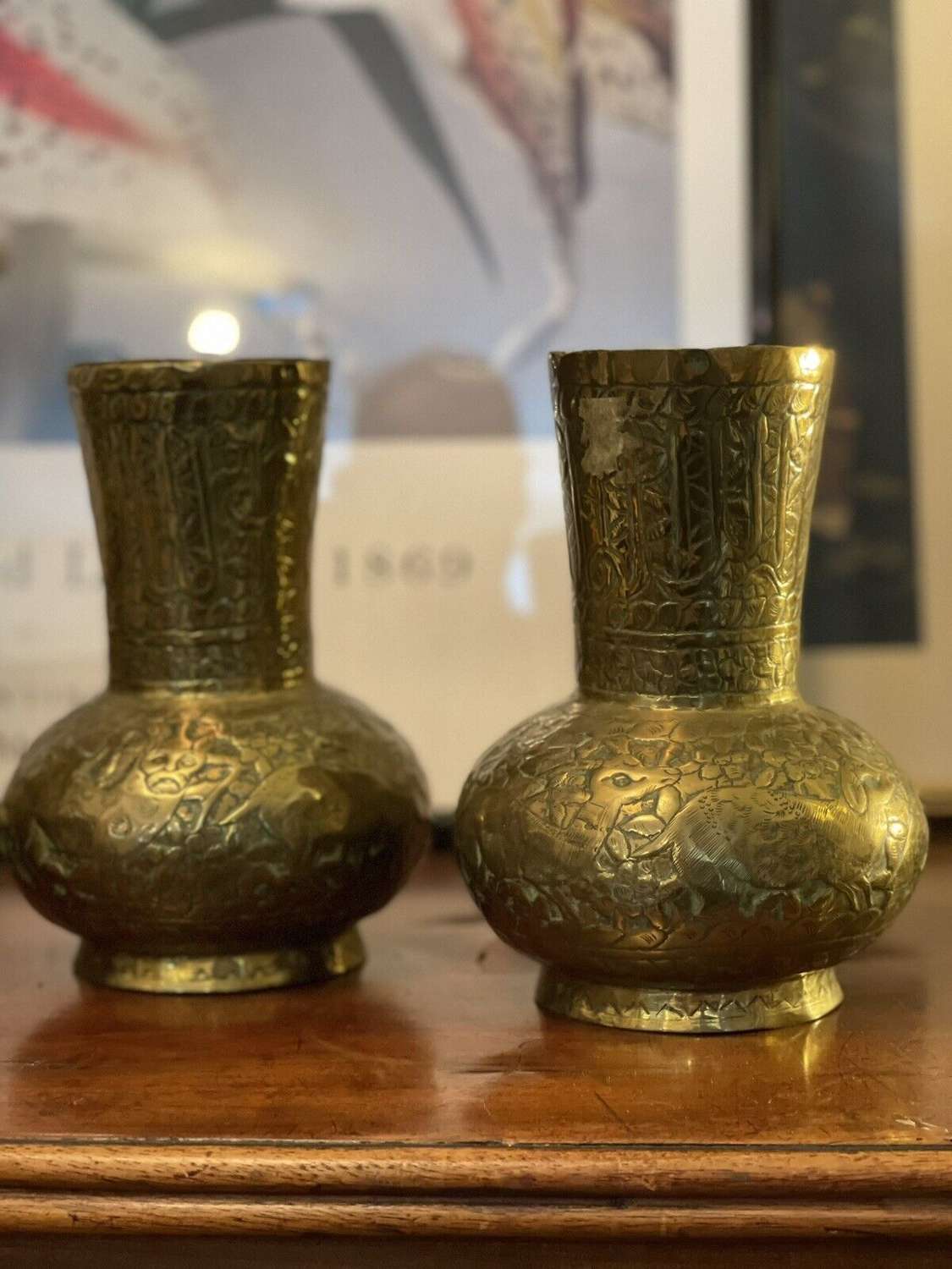 A pair of brass Islamic vases