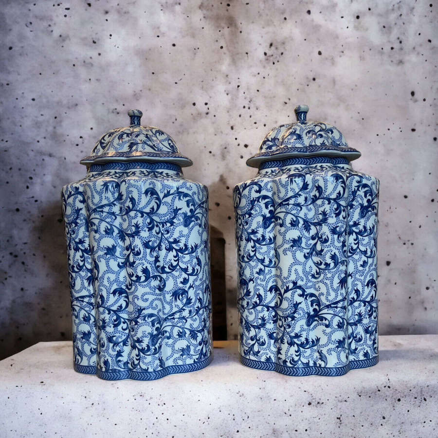 A pair of large covered blue and white Chinese style jars
