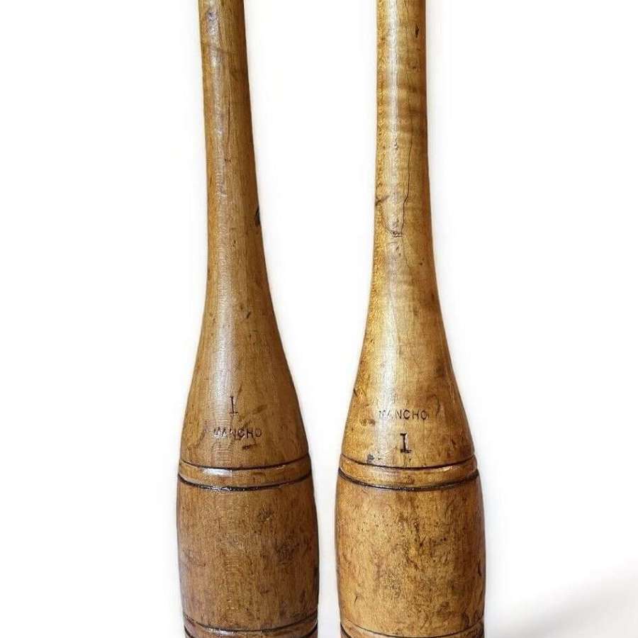 A fabulous pair of antique wooden exercise / juggling clubs.