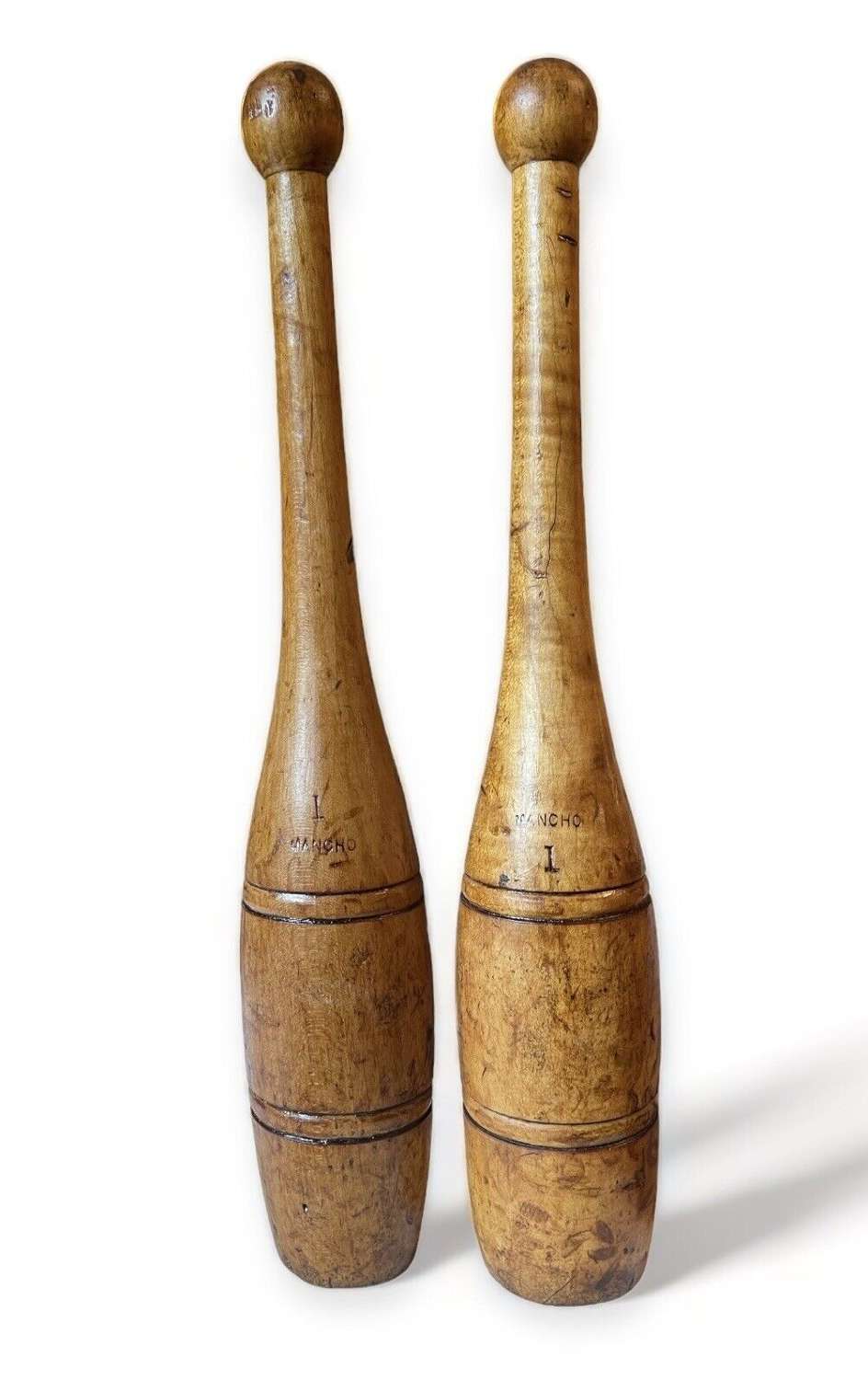 A fabulous pair of antique wooden exercise / juggling clubs.