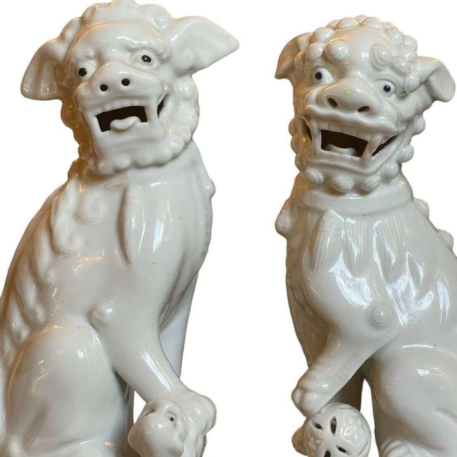 A pair of Mid Century Blanc de Chine Chinese Foo Dogs