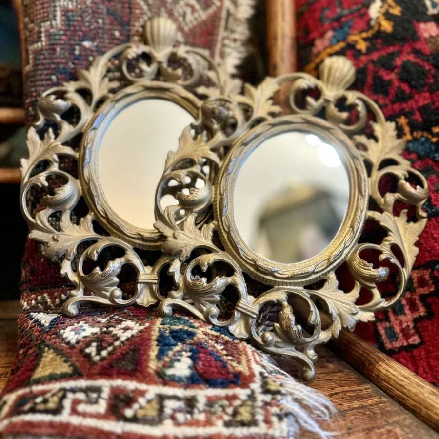 A pair of French Metal wall mirrors